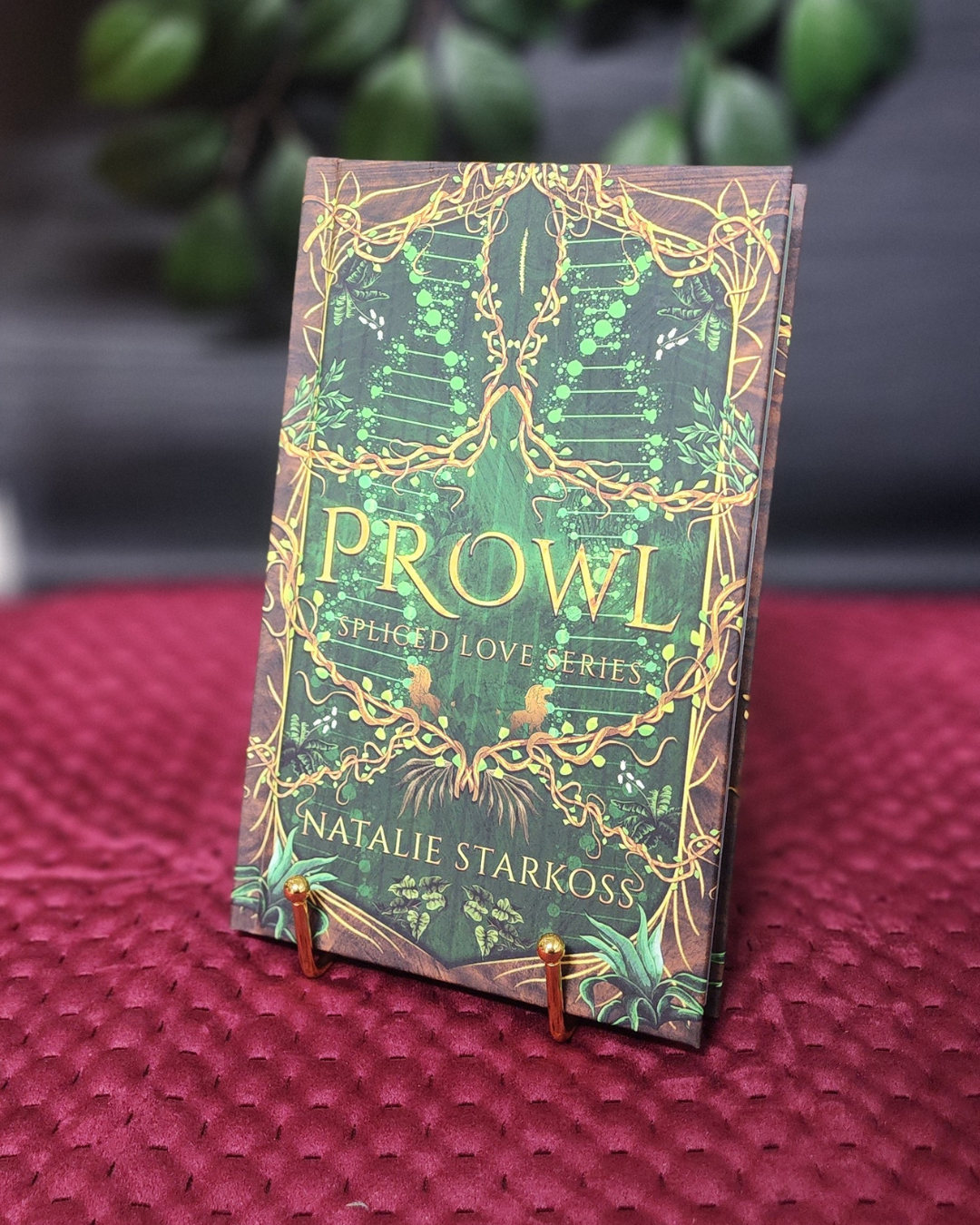 Book titled 'Prowl' by Natalie Starkoss on a stand with a blurred background